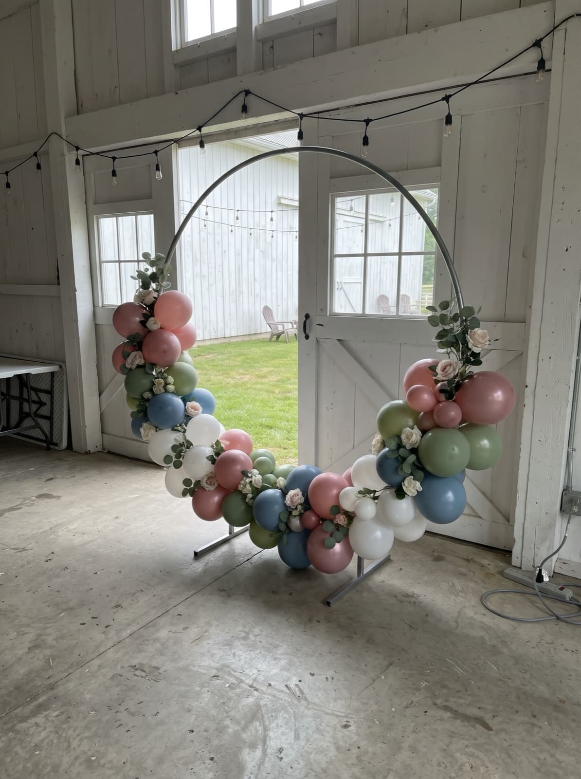 Balloon hoop backdrop with florals