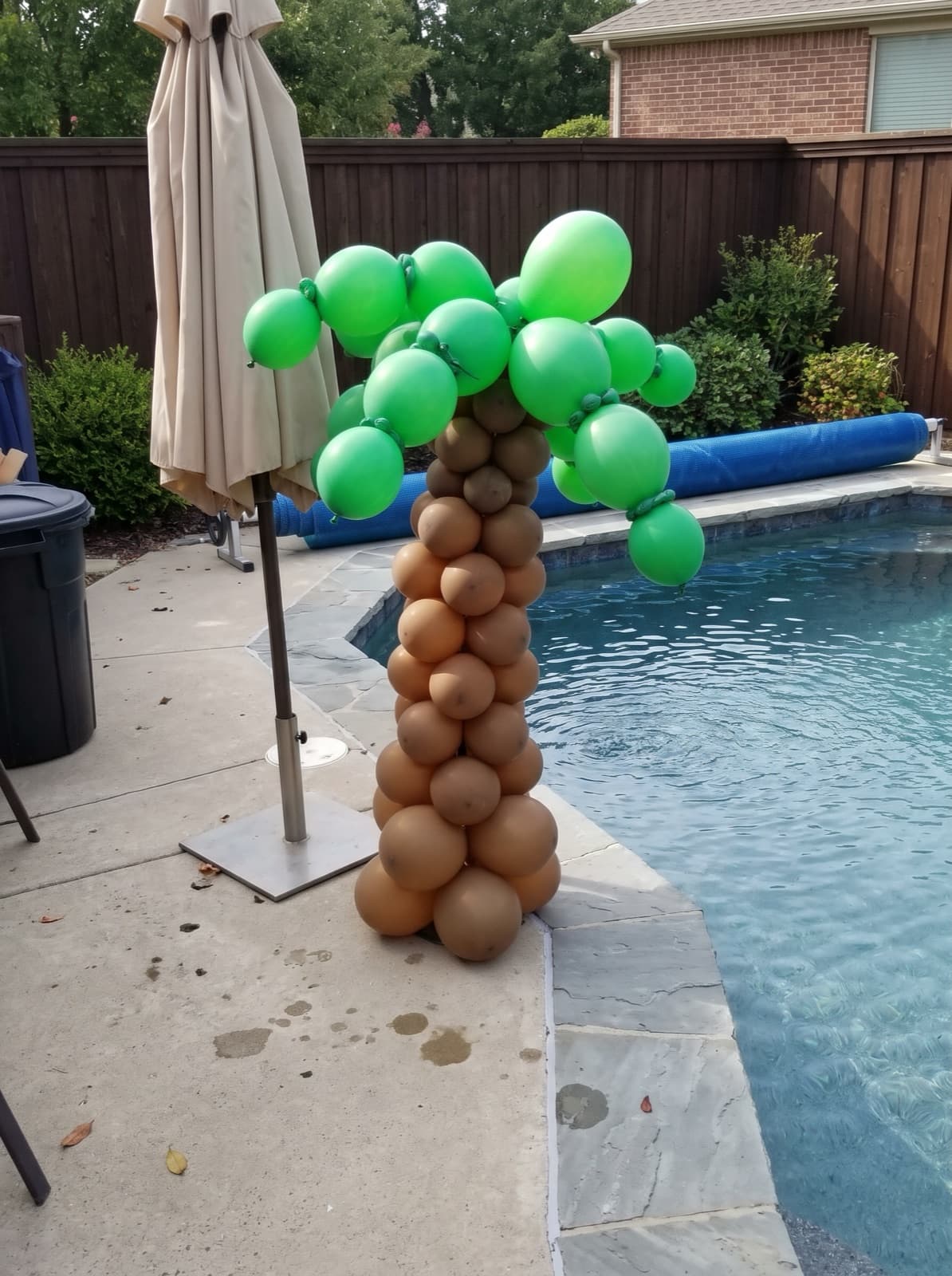 Palm tree balloon column at a pool party