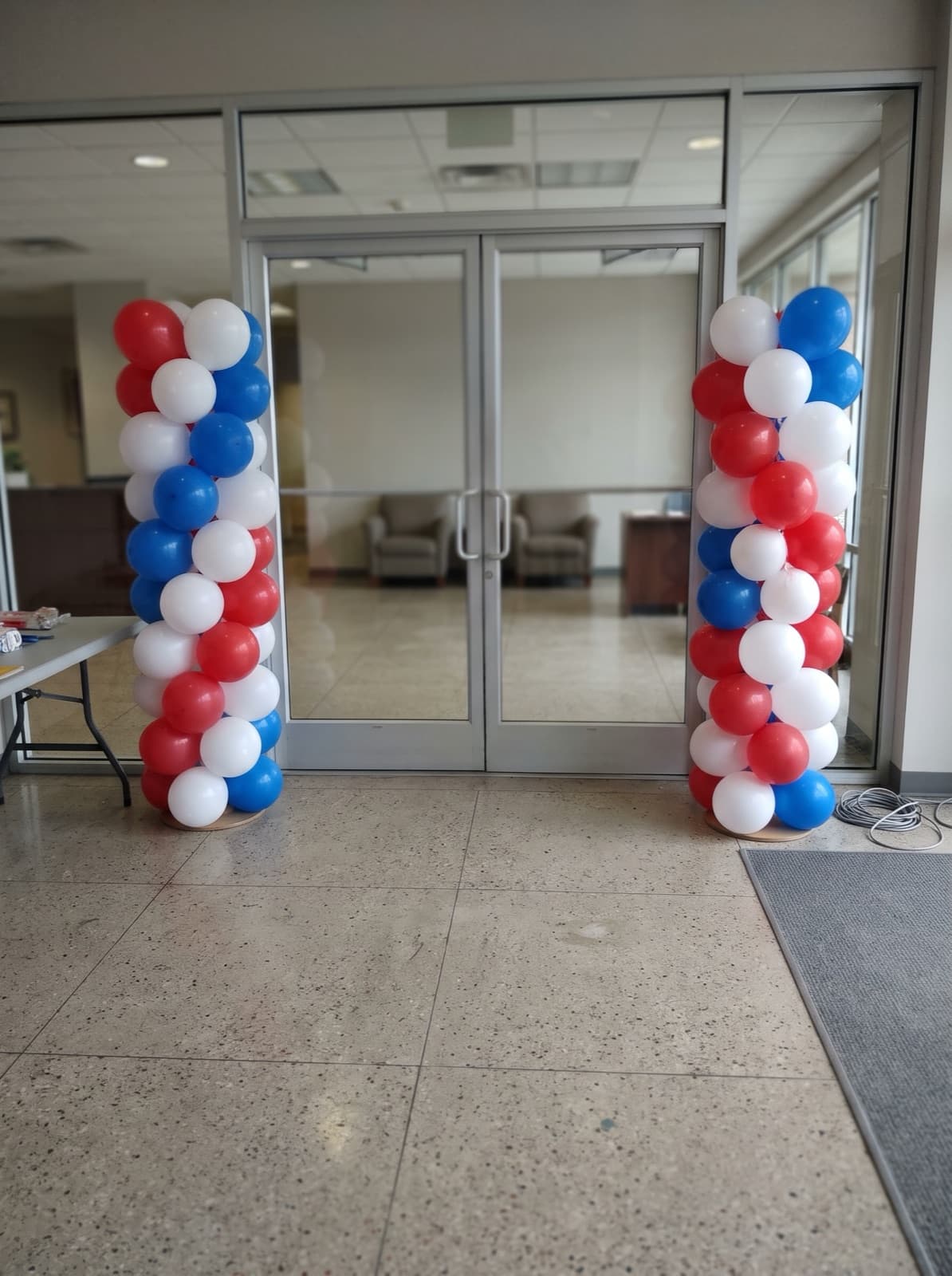 Red, white and blue spiral balloon columns