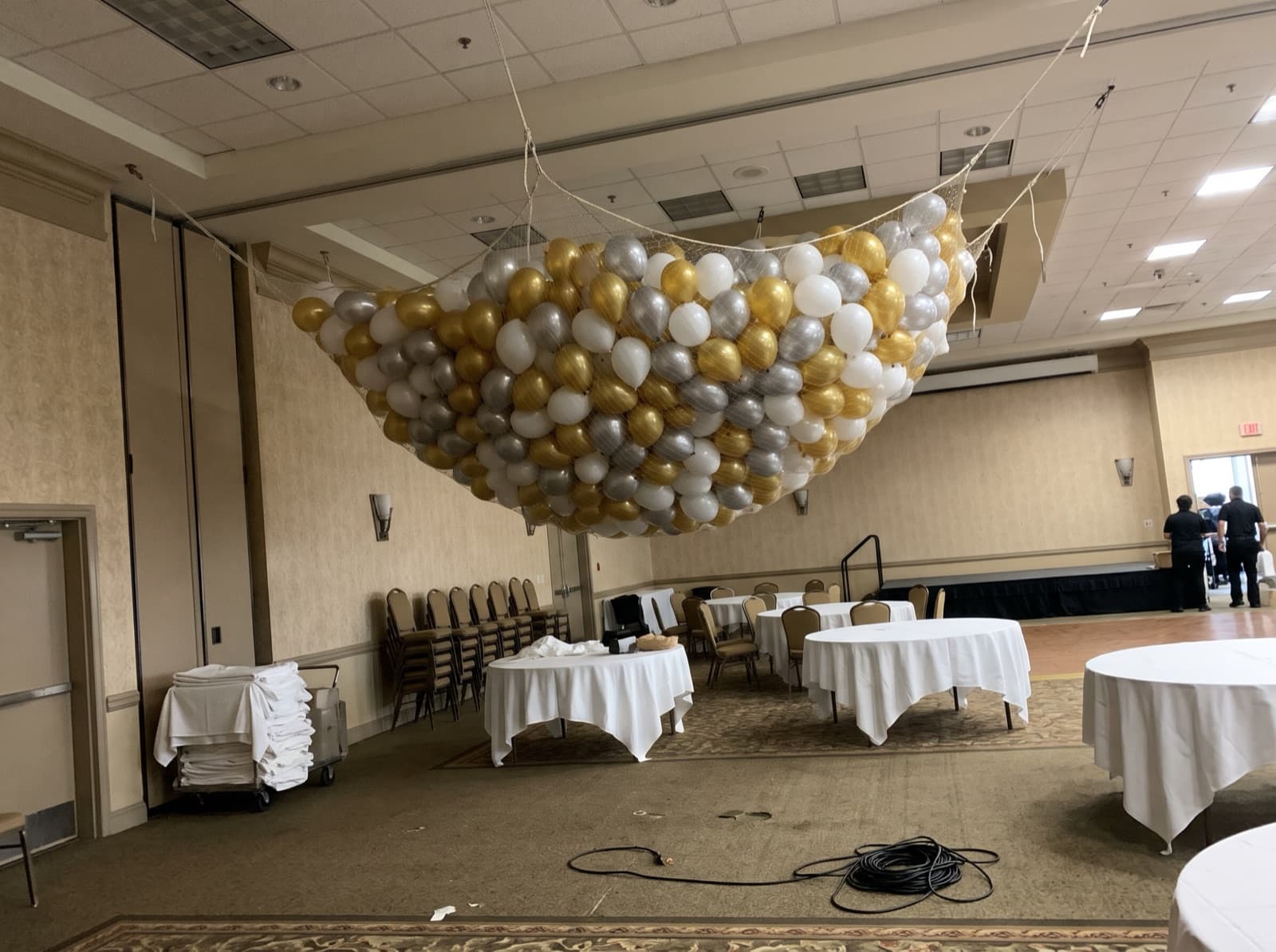 Balloon drop net overhead before a countdown