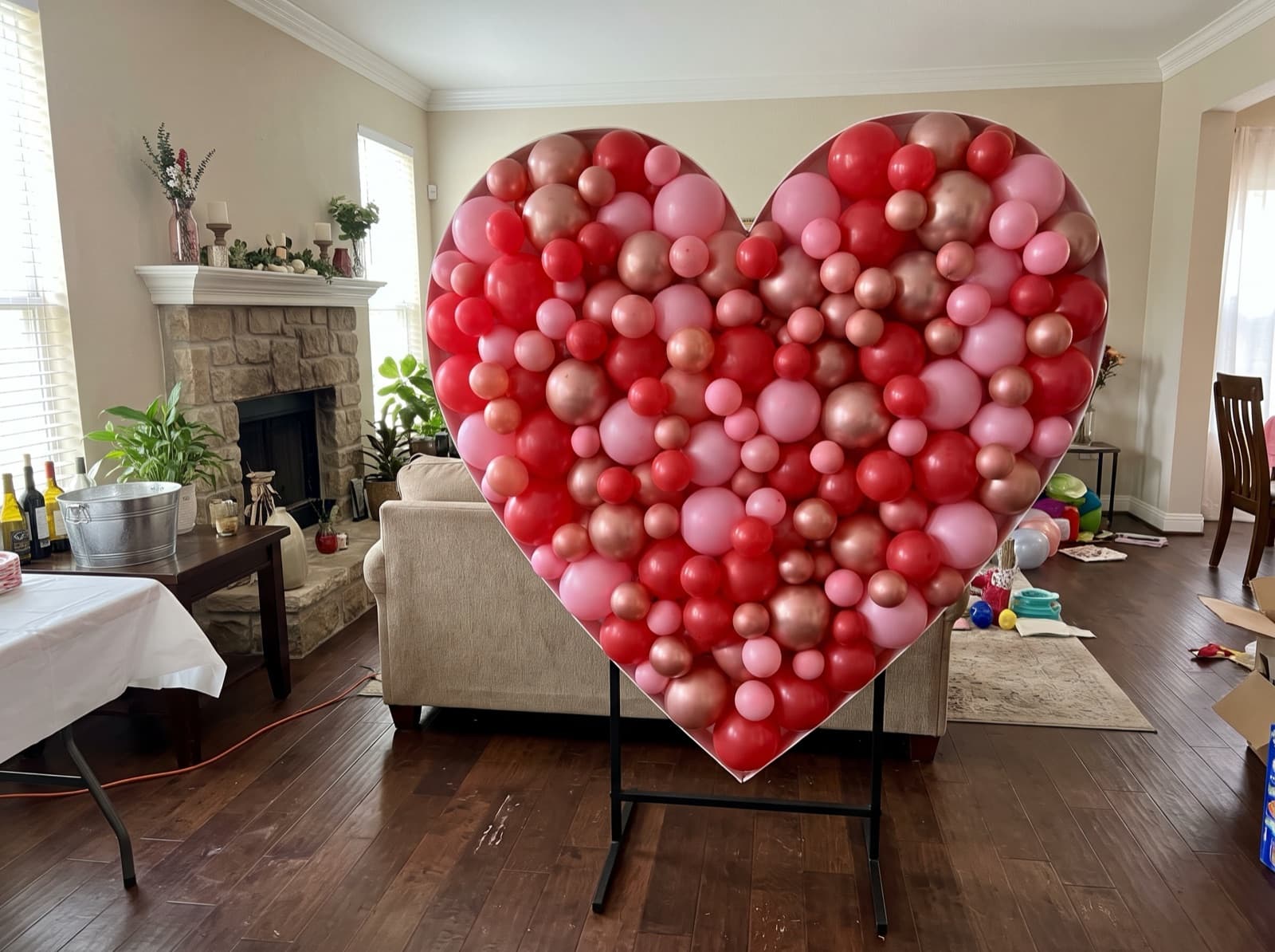 Heart-shaped balloon mosaic in red and pink