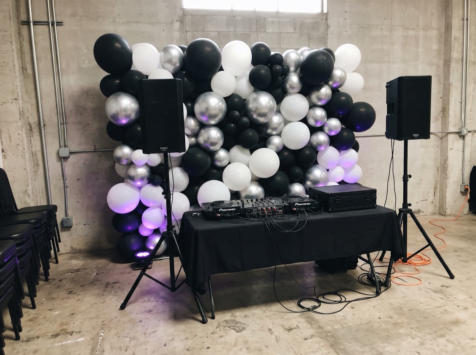 Balloon wall behind a DJ booth