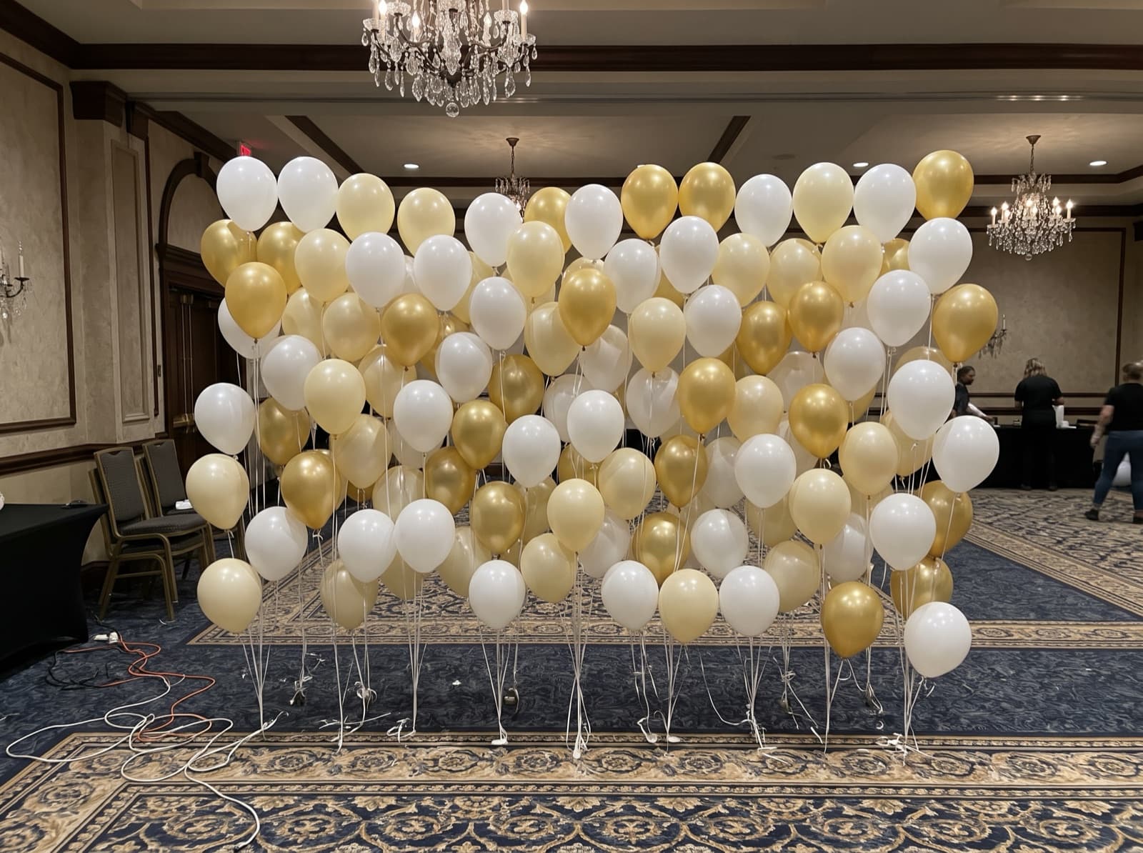 Floating helium balloon wall with ribbons