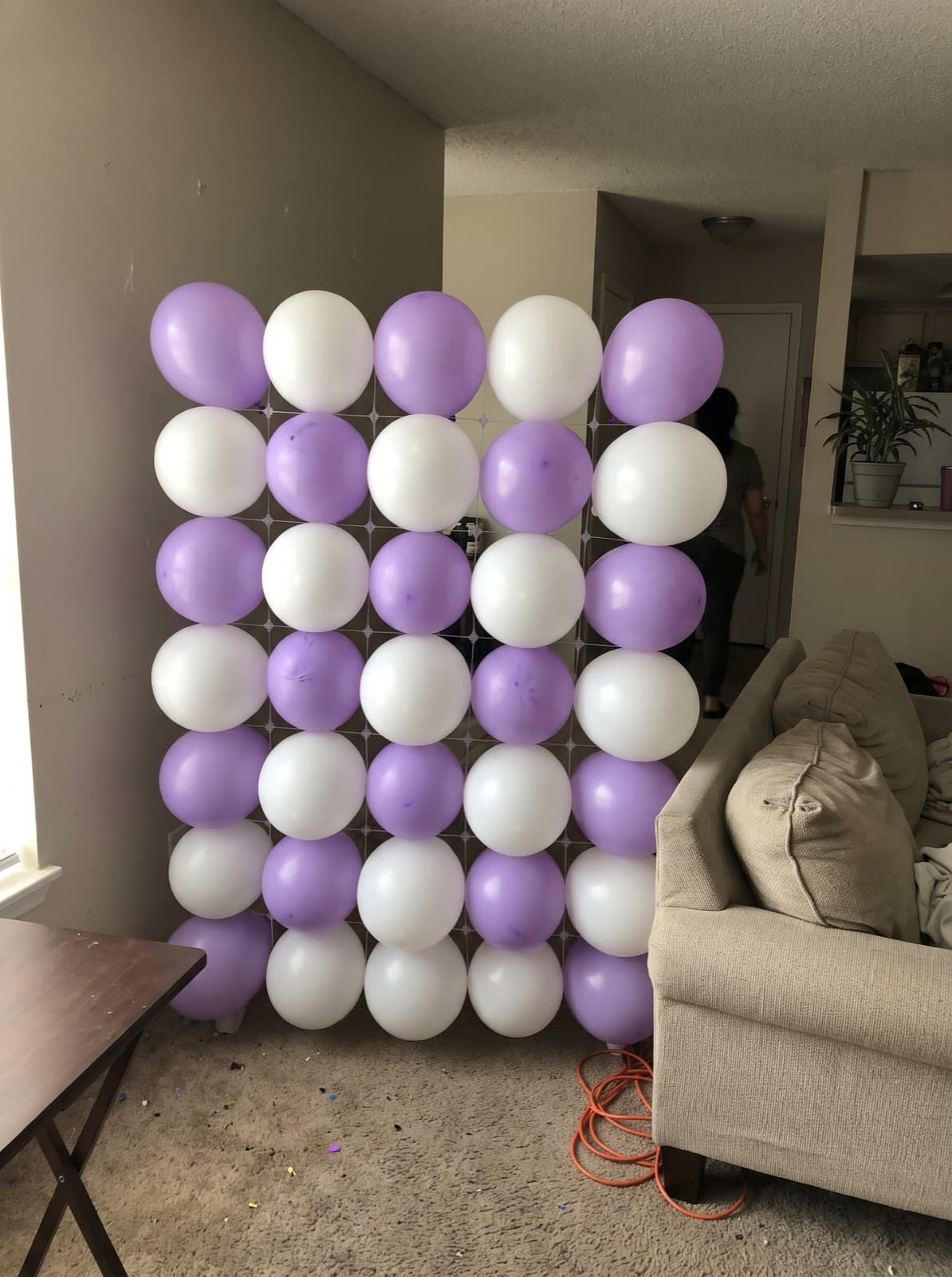 Grid balloon wall in a lavender and white checkerboard